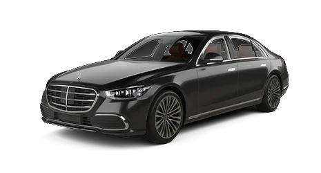 Black Mercedes-Benz luxury sedan viewed from the front left side, featuring chrome grille, alloy wheels, and sleek body design