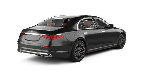 Black Mercedes-Benz sedan viewed from the rear left side, featuring LED tail lights, dual exhausts, and alloy wheels