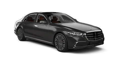 Black Mercedes-Benz sedan viewed from the front right side, showcasing chrome grille, sporty alloy wheels, and luxury design